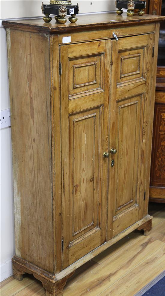 A pine two door cupboard
